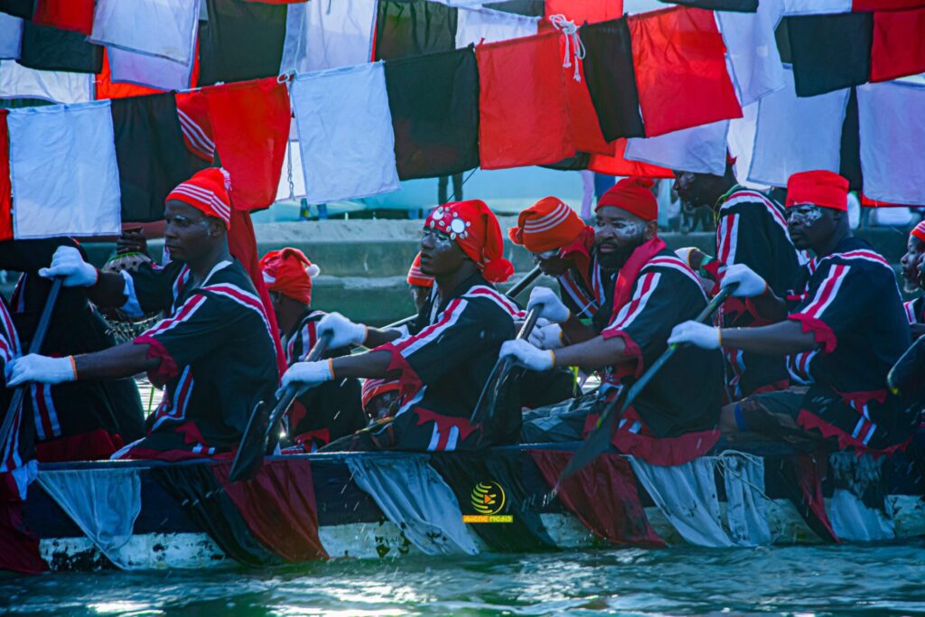 SparkBayelsa-Colorful boat crew rowing together vibrantly