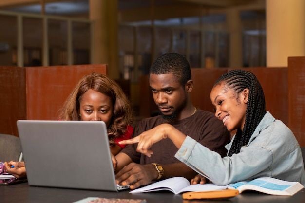 SparkBayelsa-Students collaborating on a laptop project